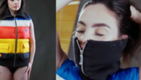 Pretty girl zipping up in Adidas Puffer vest with high zip collar