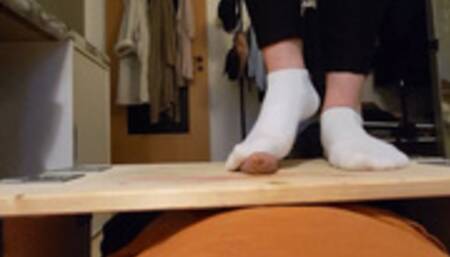 Footjob in white socks on cockboard