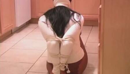 Elbow bound in white sweater and pantyhose neck roped escape attempt