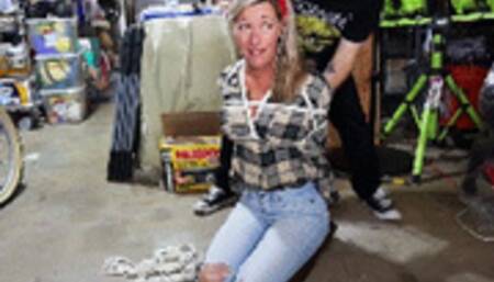 Housewife Amanda Kent finds herself tied up and gagged in the basement during a home invasion!