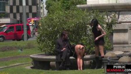 Public naked slut whipped outdoor by master and domina