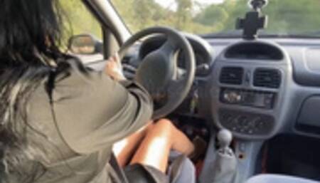 Mme Georgia drives and plays with the car in Black Sandal - Over shoulder view