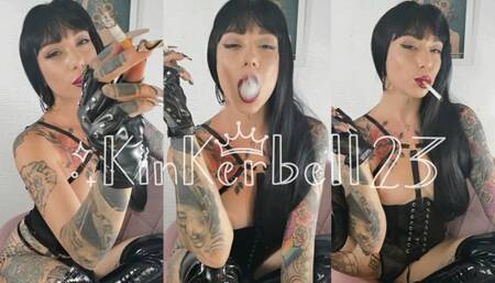 Human ashtray wearing PVC and Leather gloves