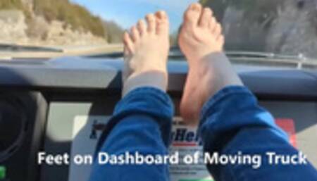 Feet on Dashboard of Moving Truck