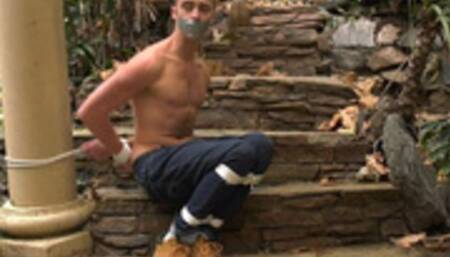 Bare chested blue eyed blonde sits bound in the great outdoors! 1080p Version