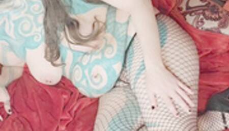 Goth girlfriend sensually teases in her fishnet stockings