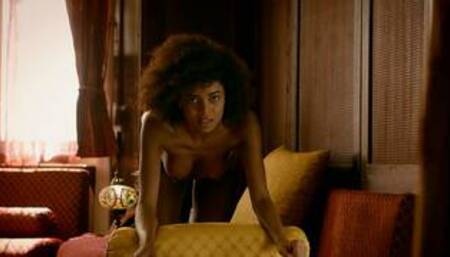 Curly ebony model shows perfect petite body after hot striptease action