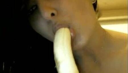 Naughty Indian babe sucking a banana on camera
