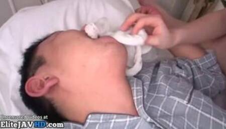 Japanese hot nurse in pantyhose plays with patient