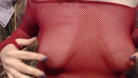 Teasing tits in red fishnet