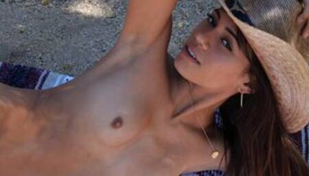 Petite naked exotic muse posing outdoor