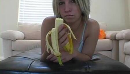Cock teasing teen peels banana