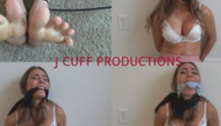 Anastasia: Handcuffed wrists, zip tied ankles and sock and cleave gagged (WORSHIP HER FEET!)