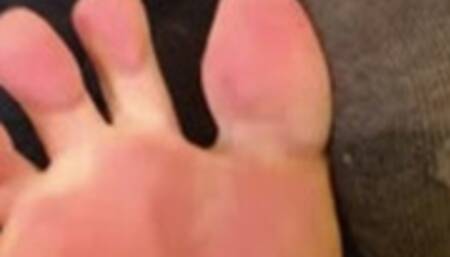 Feet show, one sock on one sock off