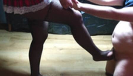 Beautiful schoolgirl kicks the slave's balls