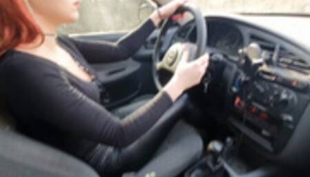 Redheaded girl tries to drive