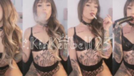 Smoking and playing with big dildo wearing fishnet lingerie