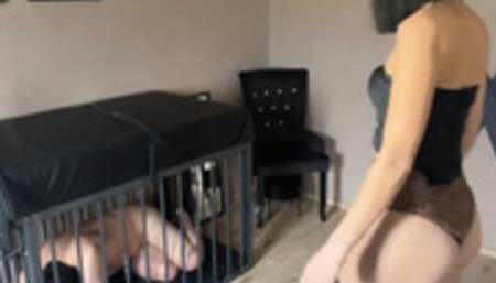 Feeding a slave in a cage