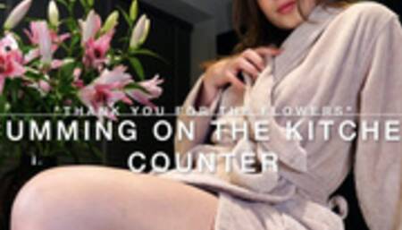 Cumming on the kitchen counter