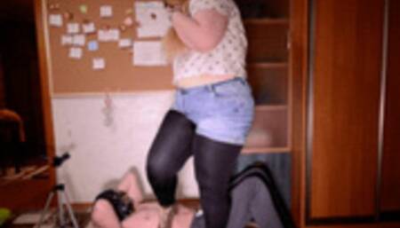 Popping balloons on the body of a slave