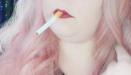 Nicki Pie chainsmoking corks in leather and stilettos