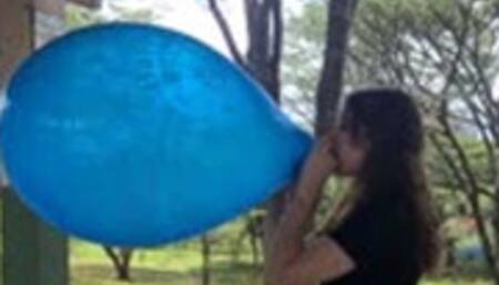 Katie Blows to Pop a Printed Unique 16" Balloon