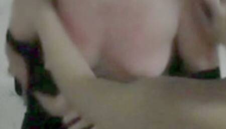 The blonde dominatrix plays with her long nails on her girlfriend's breasts