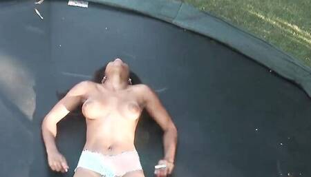 Ivy Sherwood is playing with her pussy naked in the yard