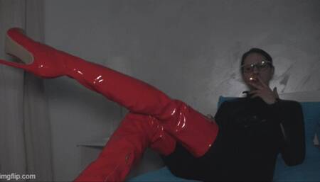 A girl in latex boots and catsuits smoking