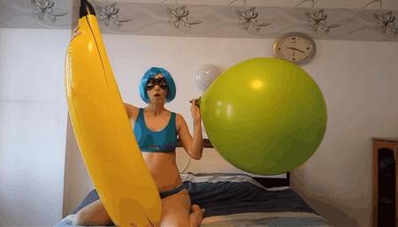Irene inflates a balloon riding on a banana