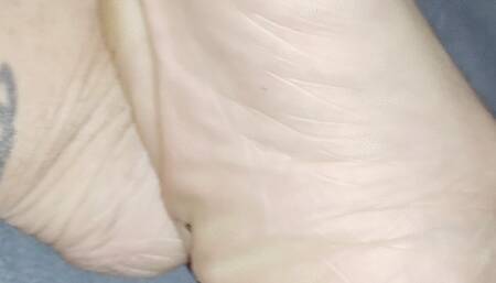 Up close wrinkled soles and calves