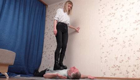 Teenage blonde tramples chest of the man lying on the floor, vf2658h 720p