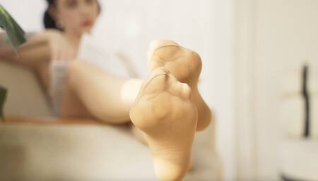 Calloused feet rest in the sun (4K)