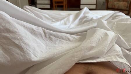 Happy morning footjob under the covers