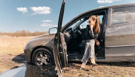 CAR STUCK Stuck in the mud while reversing