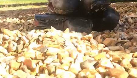 boots crushed with car in gravel