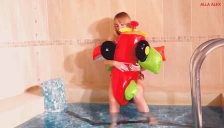 Alla blows off a small inflatable plane in the pool!!!
