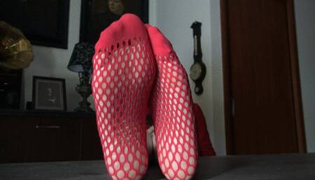 WORSHIP MY FEET IN RED SOCKS PIERCED ON THE TABLE