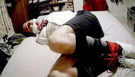 Hogtied man struggling in adult school uniform and plimsolls-BBW domination,BBW Bondage,man in bondage,male bondage,man tied up,bound and gagged man,amateur,argyle socks,hogtie,struggling,rope bondage,gay bondage,schoolboy,escape challenge,shorts,