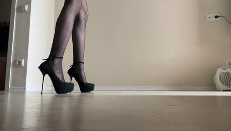 a girl in nylon stockings and high heels slides on the floor because of a puddle of sperm, falls into her