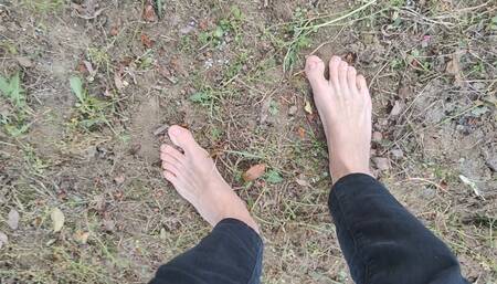Walking barefoot in the garden and showing my dirty soles