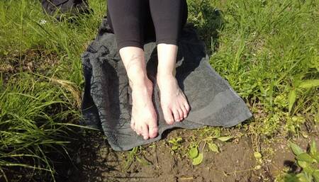 My naked feet in the cool brook