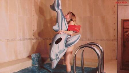 Alla quickly deflates a small inflatable dolphin in the pool!!!