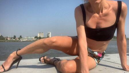 Legs and sandals by the river