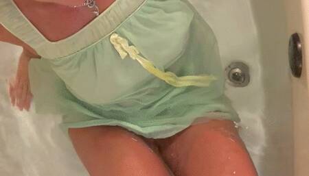 Carissa in the vintage babydoll pjs playing with the custom glass dildo