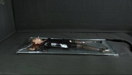 Turns in an evening gown in a vacuum bed