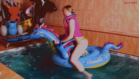 Alla hot fucks a beach ball riding an inflatable dragon in the pool!!!