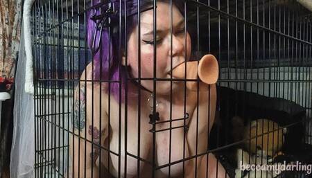 BBW puppy practicing deepthroating in cage!