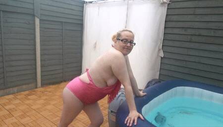 Swimsuit bouncing boobs in the hot tub