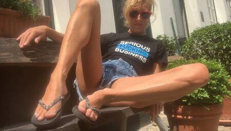 Black and glitter flip flops